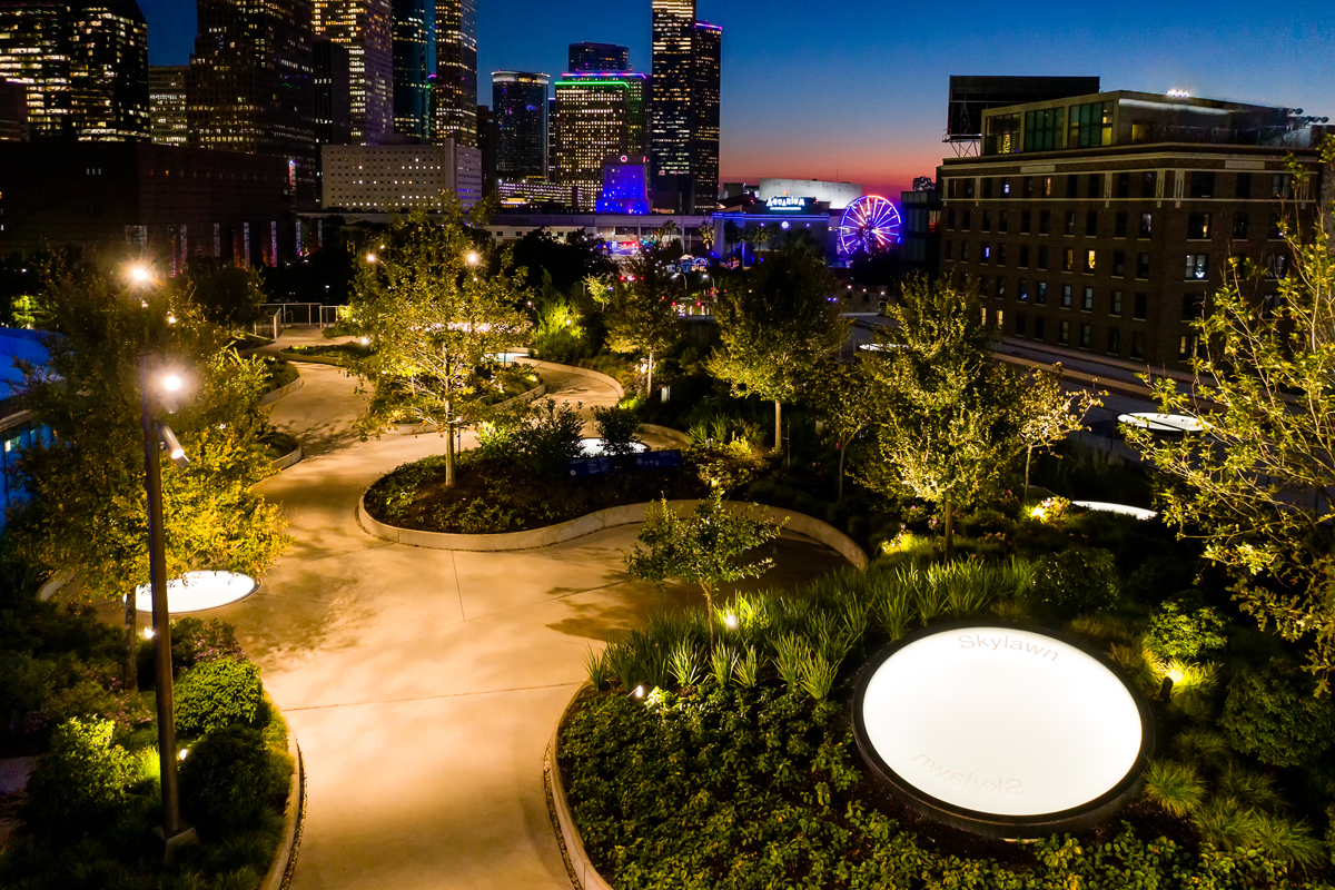 A shot of the rooftop of Post HTX in Houston as the sun sets at night