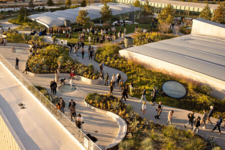 An overhead shot of guests at Post HTX enjoying the rooftop and the glass skylights