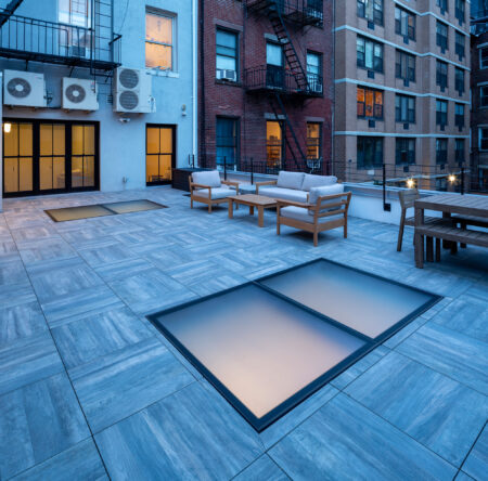 A patio cover with integrated skylights, combining outdoor living with natural lighting for a bright, inviting space below.