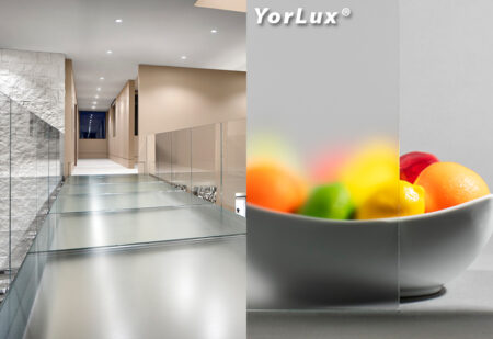 Image of a modern YorLux glass walkway with frosted finish, alongside a clarity test comparing transparent and blurred views of a fruit bowl.