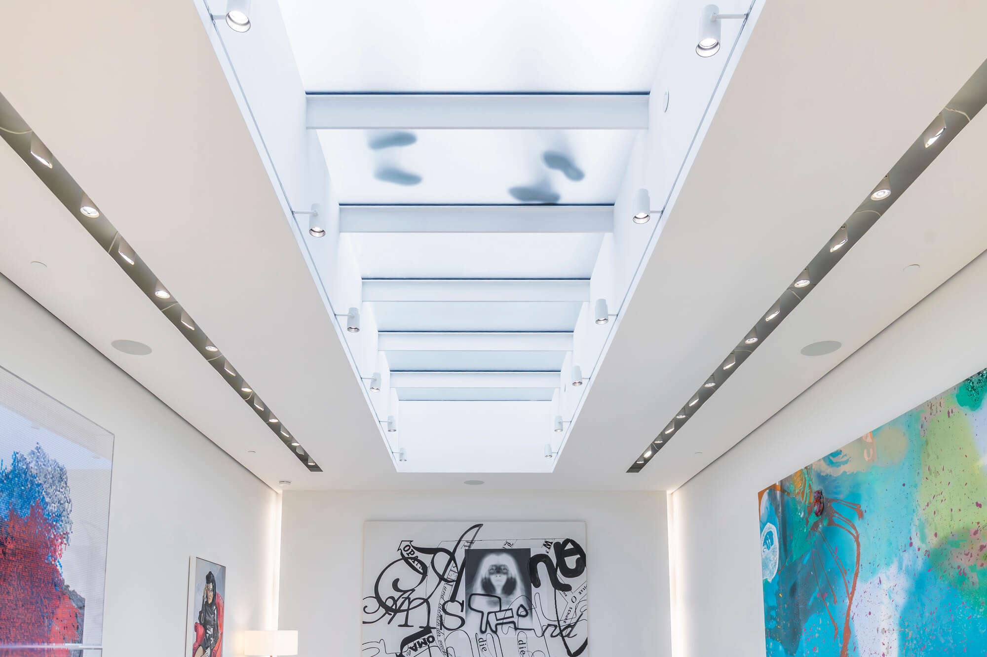A painting gallery with a textured glass roof.