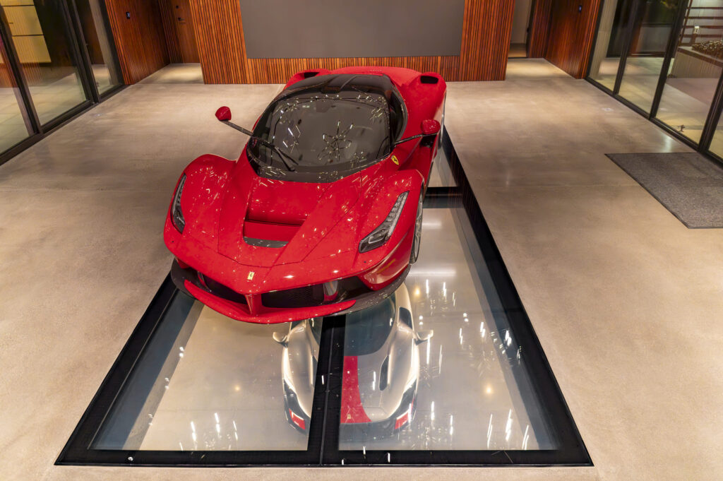 A red Ferrari on single display in a showroom.