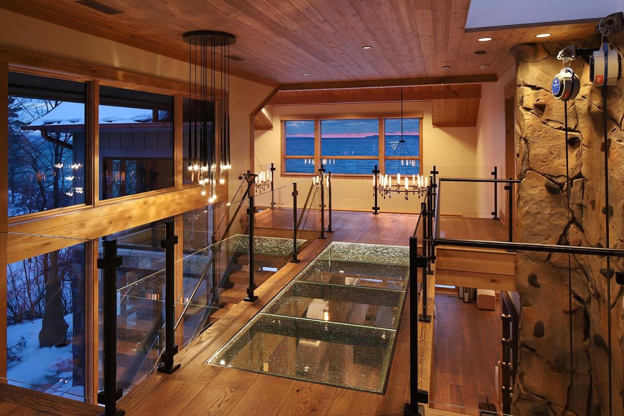 Restaurant interior with glass flooring overlooking a lower level.