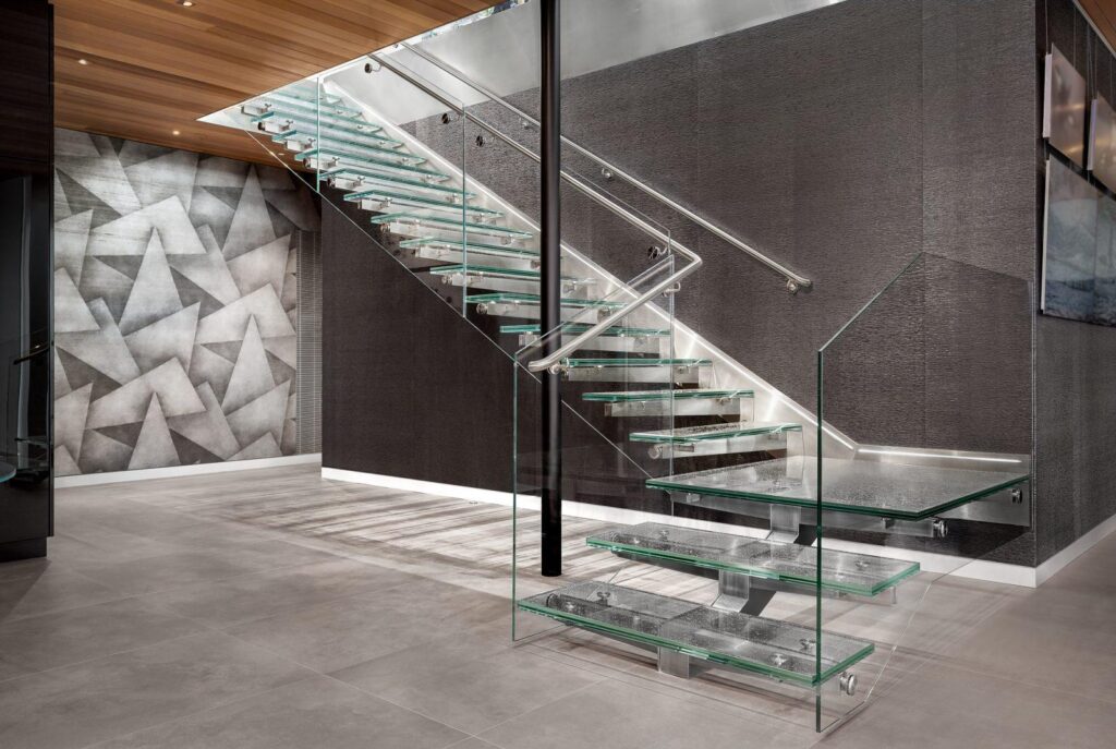 Wide glass staircase to the lower level