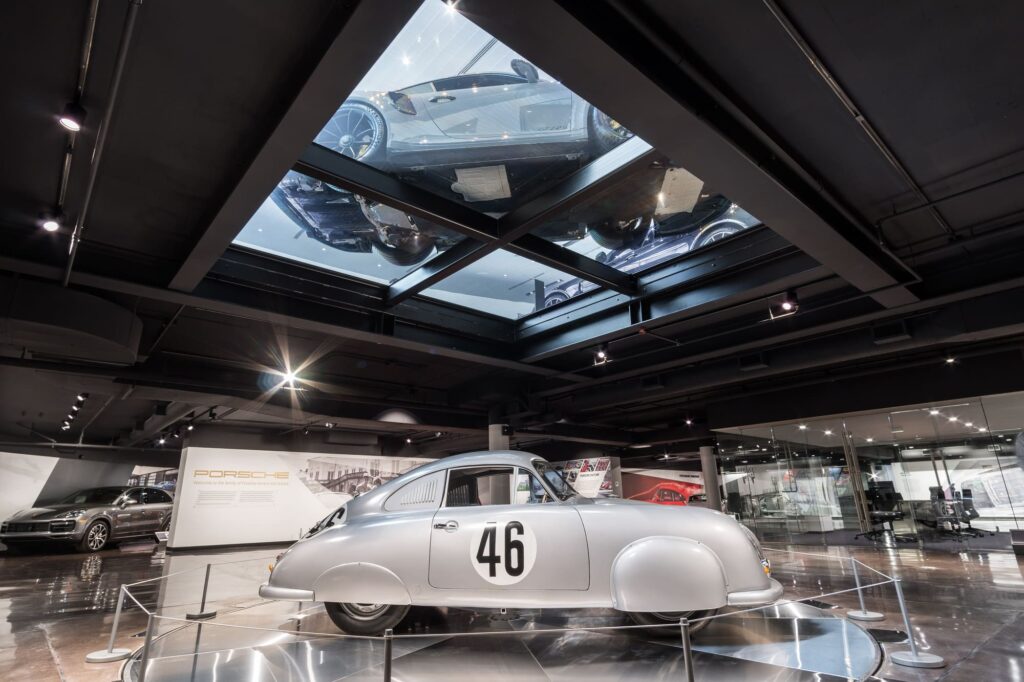 The luxury car dealer is showcasing a silver Porsche 356.