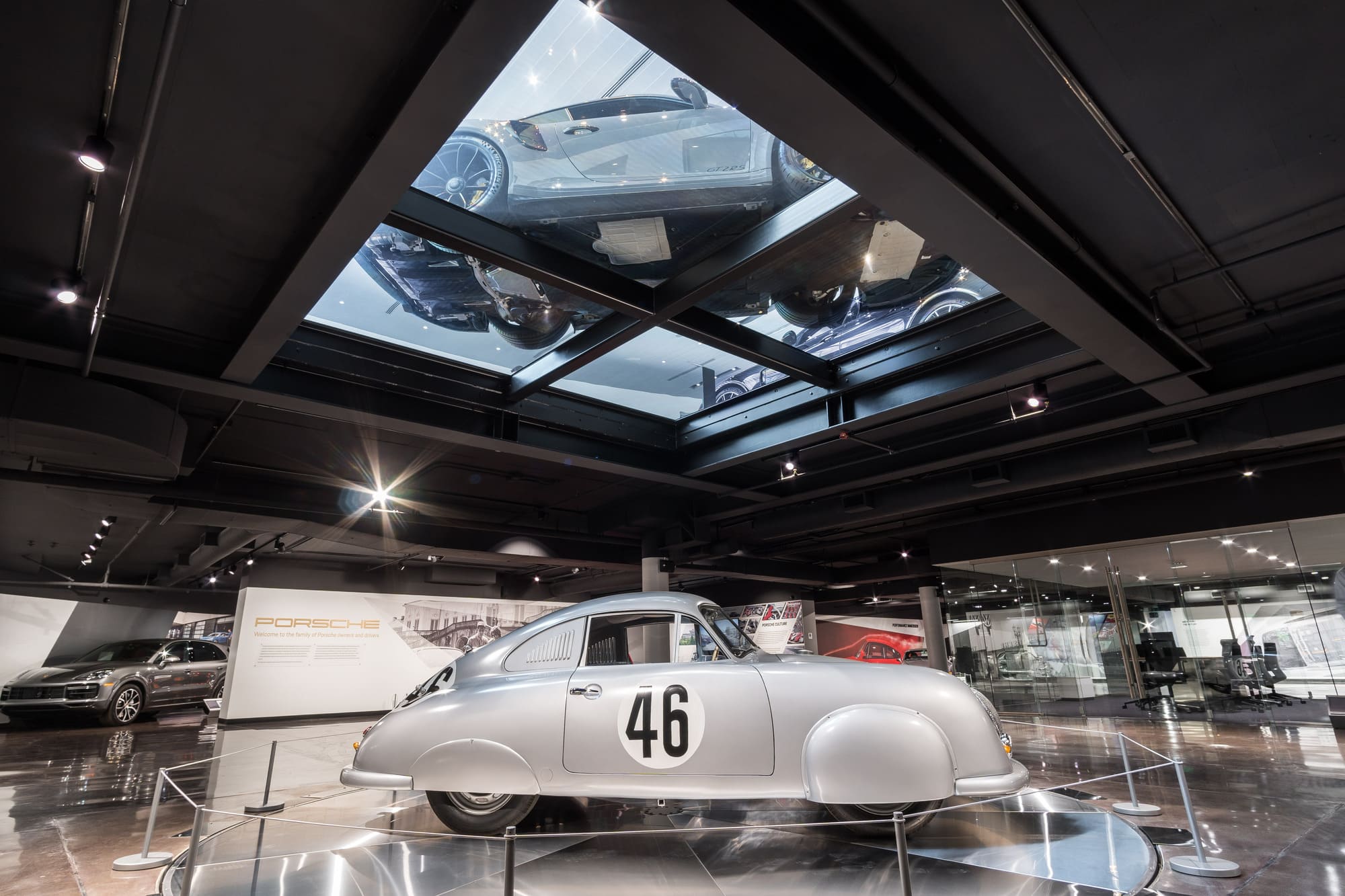The luxury car dealer is showcasing a silver Porsche 356.