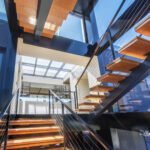 A walkable skylight illuminating stairs with natural daylight in a modern luxury home.