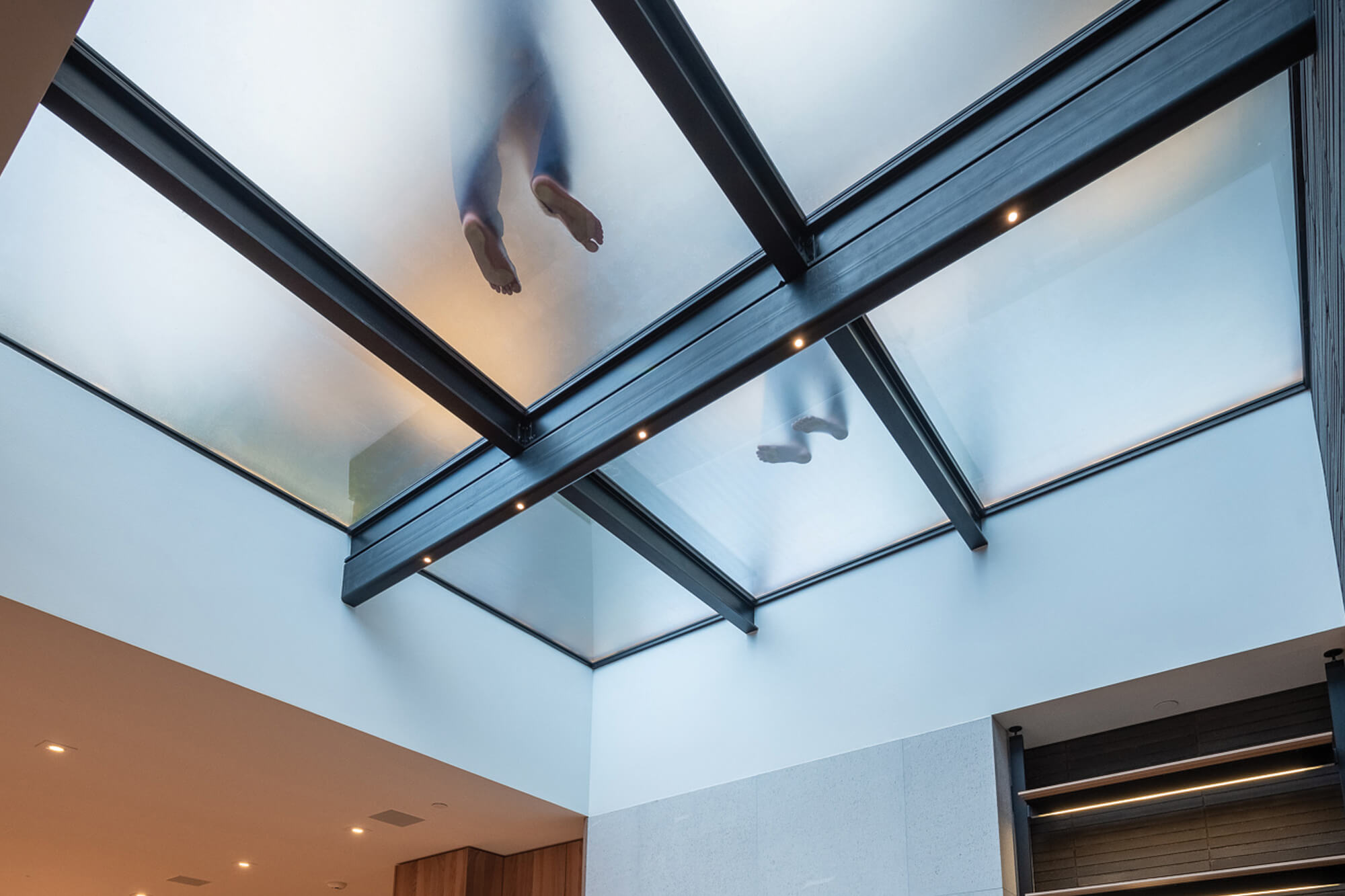 An indoor living space with a walkable skylight.